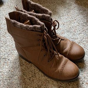 Brown combat boots with sweater material accent
